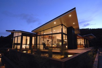 Modern home lit at dusk
